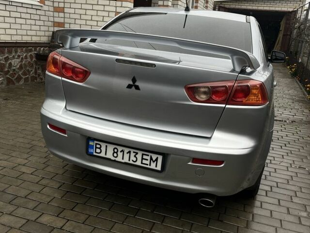 Серый Мицубиси Лансер, объемом двигателя 2 л и пробегом 227 тыс. км за 6600 $, фото 5 на Automoto.ua