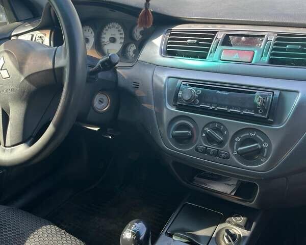 Сірий Міцубісі Lancer, об'ємом двигуна 1.6 л та пробігом 274 тис. км за 3700 $, фото 4 на Automoto.ua
