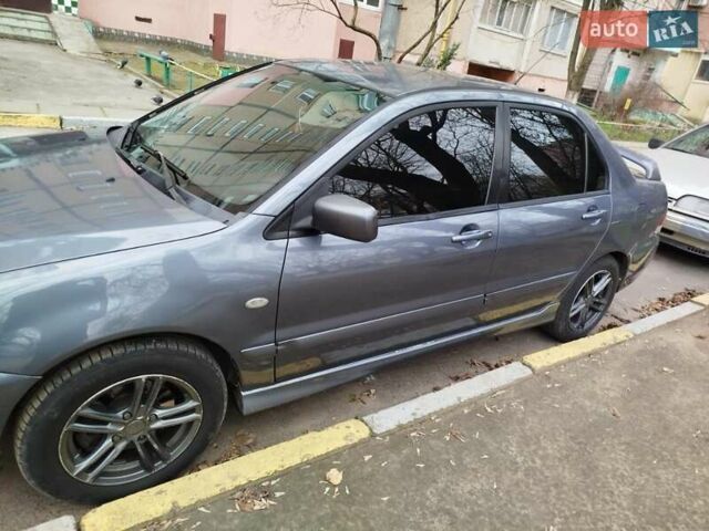 Сірий Міцубісі Lancer, об'ємом двигуна 1.58 л та пробігом 250 тис. км за 4750 $, фото 1 на Automoto.ua