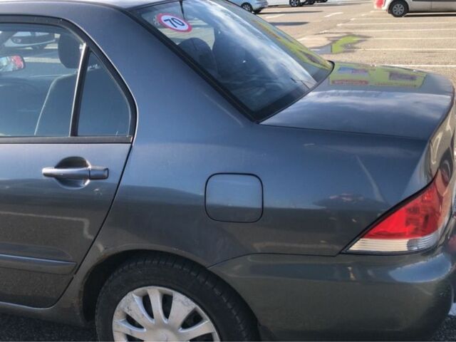 Серый Мицубиси Лансер, объемом двигателя 1.5 л и пробегом 269 тыс. км за 4200 $, фото 4 на Automoto.ua