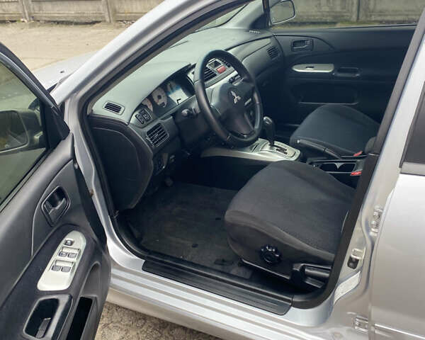 Серый Мицубиси Лансер, объемом двигателя 1.58 л и пробегом 240 тыс. км за 5500 $, фото 14 на Automoto.ua