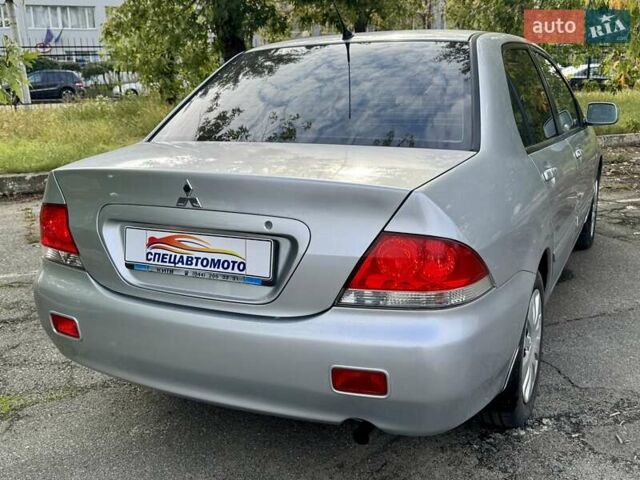 Сірий Міцубісі Lancer, об'ємом двигуна 1.58 л та пробігом 138 тис. км за 4990 $, фото 13 на Automoto.ua