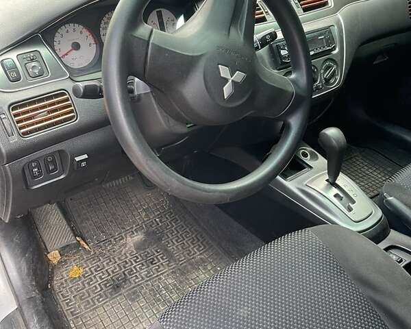 Сірий Міцубісі Lancer, об'ємом двигуна 1.58 л та пробігом 305 тис. км за 3300 $, фото 7 на Automoto.ua