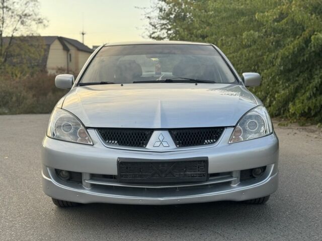 Серый Мицубиси Лансер, объемом двигателя 2 л и пробегом 185 тыс. км за 4600 $, фото 3 на Automoto.ua