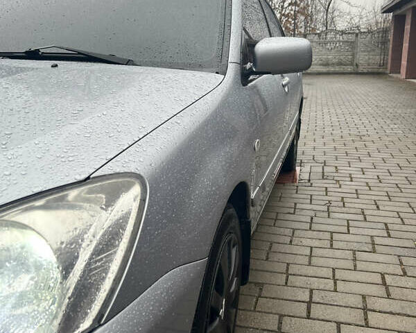 Серый Мицубиси Лансер, объемом двигателя 1.6 л и пробегом 254 тыс. км за 4500 $, фото 14 на Automoto.ua