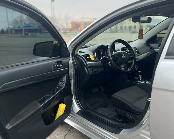 Серый Мицубиси Лансер, объемом двигателя 2 л и пробегом 286 тыс. км за 5800 $, фото 10 на Automoto.ua