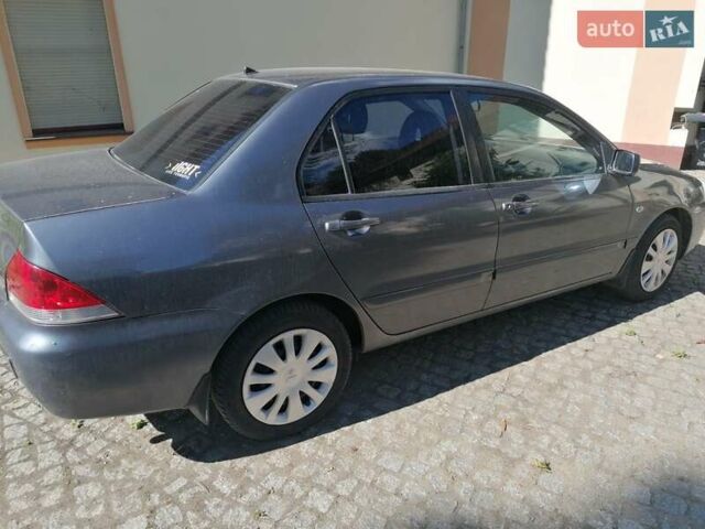 Сірий Міцубісі Lancer, об'ємом двигуна 1.6 л та пробігом 205 тис. км за 3800 $, фото 5 на Automoto.ua
