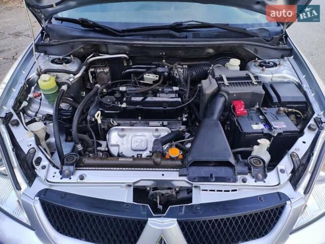 Сірий Міцубісі Lancer, об'ємом двигуна 1.58 л та пробігом 122 тис. км за 6300 $, фото 41 на Automoto.ua