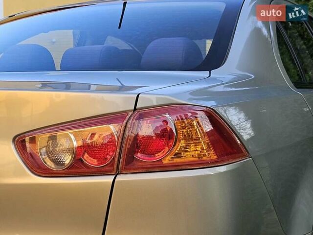 Серый Мицубиси Лансер, объемом двигателя 2 л и пробегом 282 тыс. км за 5450 $, фото 34 на Automoto.ua