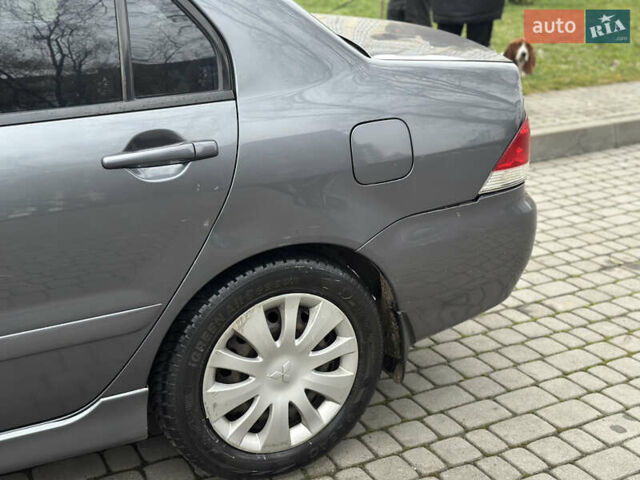 Сірий Міцубісі Lancer, об'ємом двигуна 1.6 л та пробігом 177 тис. км за 2800 $, фото 2 на Automoto.ua