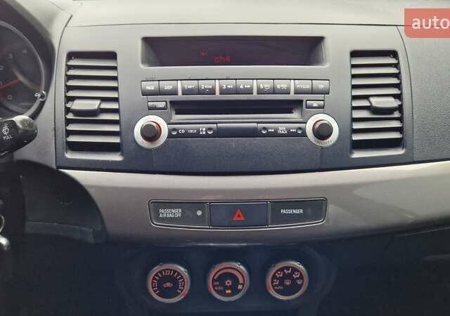 Серый Мицубиси Лансер, объемом двигателя 2 л и пробегом 213 тыс. км за 6550 $, фото 23 на Automoto.ua