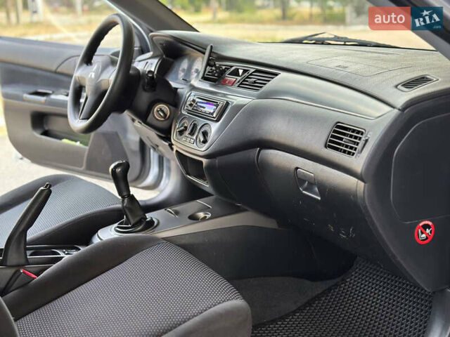 Сірий Міцубісі Lancer, об'ємом двигуна 1.58 л та пробігом 181 тис. км за 5699 $, фото 27 на Automoto.ua