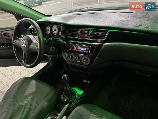 Серый Мицубиси Лансер, объемом двигателя 1.6 л и пробегом 112 тыс. км за 2800 $, фото 19 на Automoto.ua