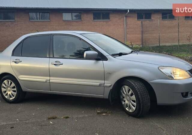 Сірий Міцубісі Lancer, об'ємом двигуна 1.6 л та пробігом 213 тис. км за 3600 $, фото 9 на Automoto.ua