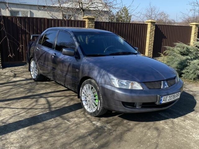 Серый Мицубиси Лансер, объемом двигателя 1.6 л и пробегом 250 тыс. км за 3999 $, фото 23 на Automoto.ua
