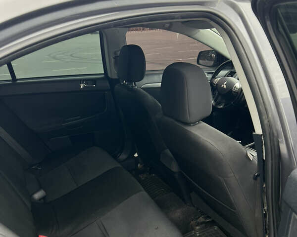 Сірий Міцубісі Lancer, об'ємом двигуна 2 л та пробігом 300 тис. км за 6299 $, фото 20 на Automoto.ua