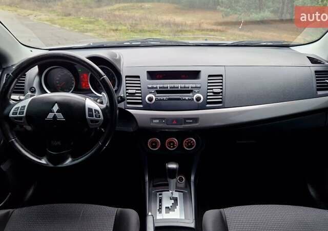 Серый Мицубиси Лансер, объемом двигателя 2 л и пробегом 213 тыс. км за 6550 $, фото 21 на Automoto.ua