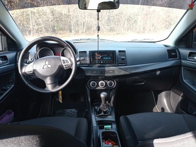 Серый Мицубиси Лансер, объемом двигателя 2 л и пробегом 180 тыс. км за 5800 $, фото 7 на Automoto.ua