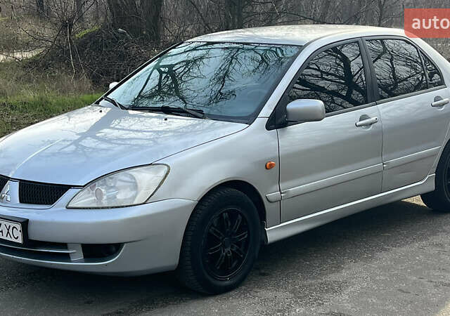 Серый Мицубиси Лансер, объемом двигателя 1.58 л и пробегом 290 тыс. км за 3750 $, фото 5 на Automoto.ua