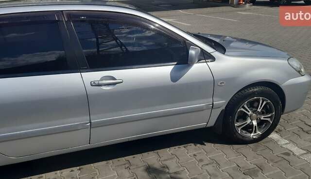 Серый Мицубиси Лансер, объемом двигателя 1.6 л и пробегом 420 тыс. км за 4900 $, фото 4 на Automoto.ua