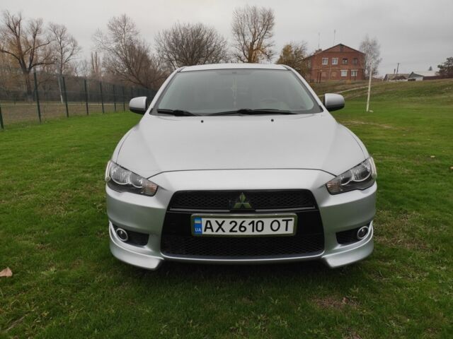 Серый Мицубиси Лансер, объемом двигателя 2 л и пробегом 124 тыс. км за 7499 $, фото 1 на Automoto.ua