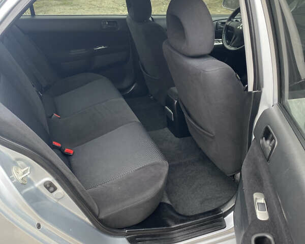 Серый Мицубиси Лансер, объемом двигателя 1.58 л и пробегом 240 тыс. км за 5500 $, фото 8 на Automoto.ua