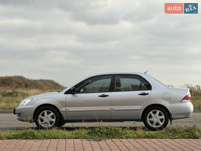 Серый Мицубиси Лансер, объемом двигателя 1.3 л и пробегом 160 тыс. км за 5555 $, фото 12 на Automoto.ua