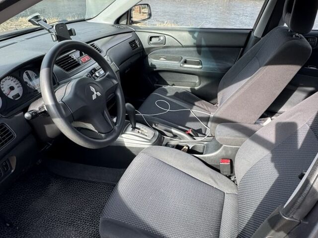 Серый Мицубиси Лансер, объемом двигателя 1.6 л и пробегом 129 тыс. км за 5000 $, фото 2 на Automoto.ua