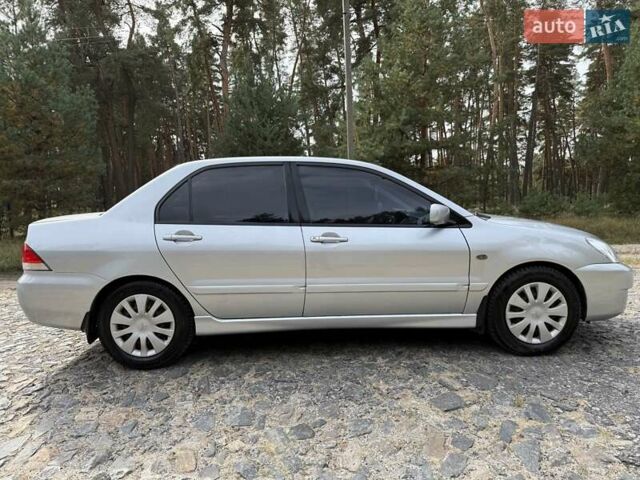 Серый Мицубиси Лансер, объемом двигателя 1.6 л и пробегом 200 тыс. км за 4400 $, фото 6 на Automoto.ua