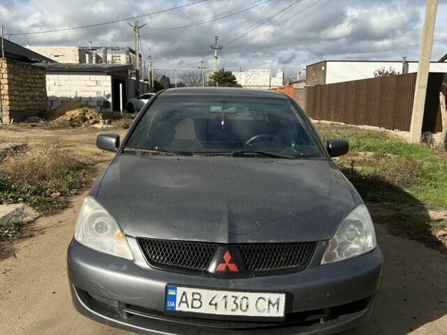 Серый Мицубиси Лансер, объемом двигателя 1.6 л и пробегом 200 тыс. км за 2300 $, фото 1 на Automoto.ua