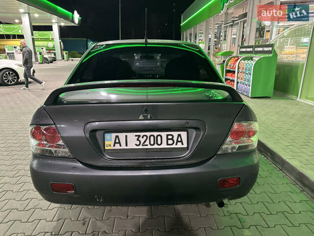 Серый Мицубиси Лансер, объемом двигателя 1.6 л и пробегом 112 тыс. км за 2800 $, фото 5 на Automoto.ua