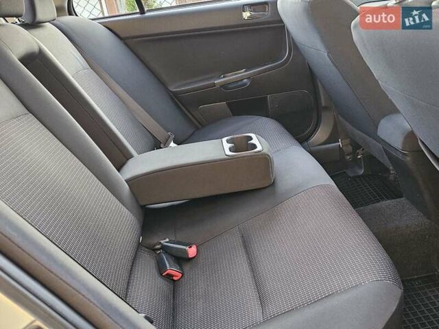 Серый Мицубиси Лансер, объемом двигателя 2 л и пробегом 282 тыс. км за 5450 $, фото 71 на Automoto.ua