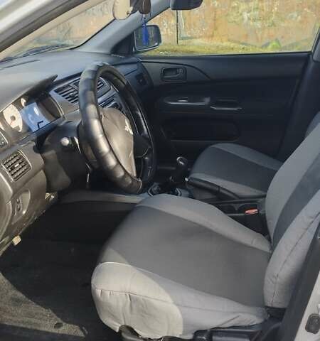 Серый Мицубиси Лансер, объемом двигателя 1.6 л и пробегом 205 тыс. км за 4500 $, фото 6 на Automoto.ua