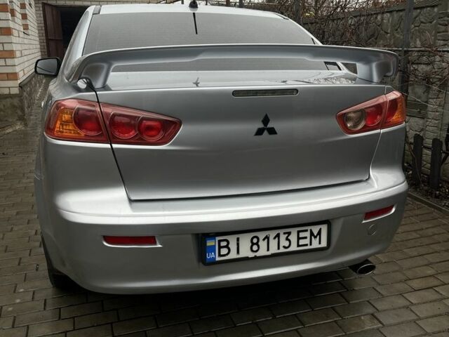 Серый Мицубиси Лансер, объемом двигателя 2 л и пробегом 227 тыс. км за 6600 $, фото 6 на Automoto.ua