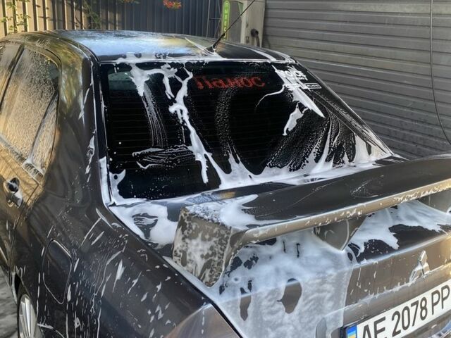 Серый Мицубиси Лансер, объемом двигателя 1.6 л и пробегом 250 тыс. км за 3999 $, фото 21 на Automoto.ua