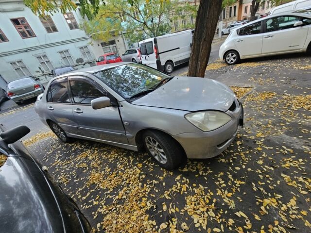 Серый Мицубиси Лансер, объемом двигателя 1.6 л и пробегом 199 тыс. км за 1450 $, фото 1 на Automoto.ua