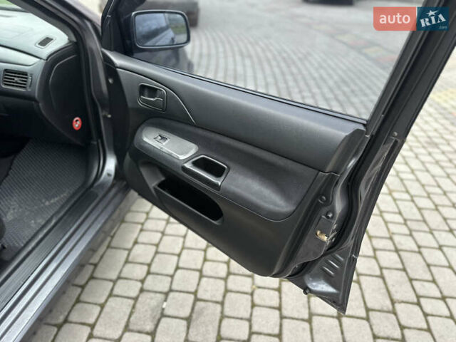 Сірий Міцубісі Lancer, об'ємом двигуна 1.6 л та пробігом 177 тис. км за 2800 $, фото 30 на Automoto.ua