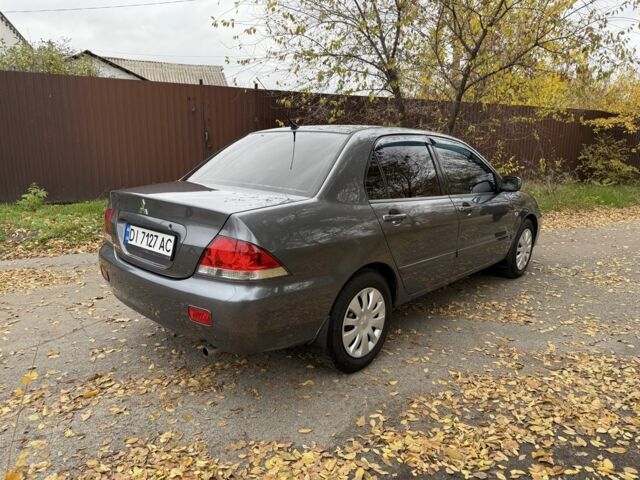 Сірий Міцубісі Lancer, об'ємом двигуна 1.6 л та пробігом 247 тис. км за 4900 $, фото 2 на Automoto.ua