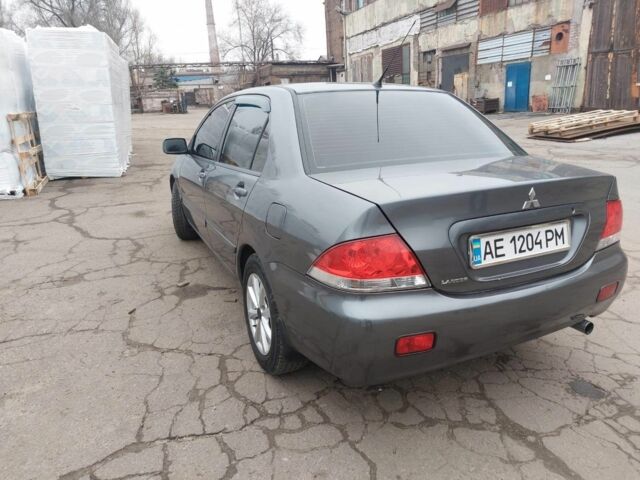 Серый Мицубиси Лансер, объемом двигателя 1.6 л и пробегом 220 тыс. км за 4200 $, фото 2 на Automoto.ua