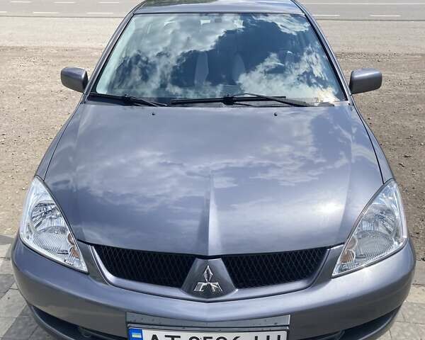 Сірий Міцубісі Lancer, об'ємом двигуна 1.59 л та пробігом 44 тис. км за 6200 $, фото 7 на Automoto.ua