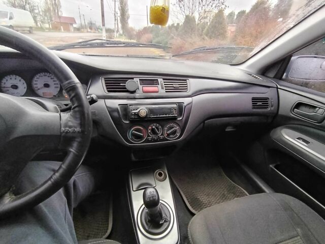 Серый Мицубиси Лансер, объемом двигателя 1.6 л и пробегом 238 тыс. км за 2900 $, фото 7 на Automoto.ua