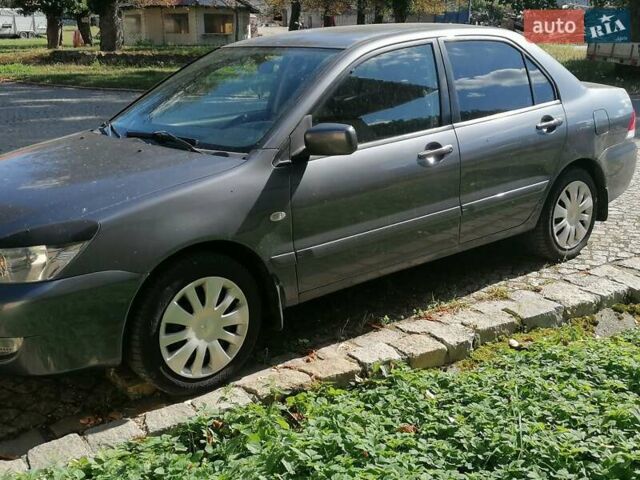 Сірий Міцубісі Lancer, об'ємом двигуна 1.6 л та пробігом 205 тис. км за 3800 $, фото 4 на Automoto.ua
