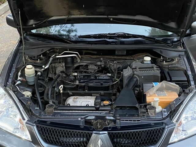 Серый Мицубиси Лансер, объемом двигателя 1.6 л и пробегом 250 тыс. км за 3999 $, фото 10 на Automoto.ua