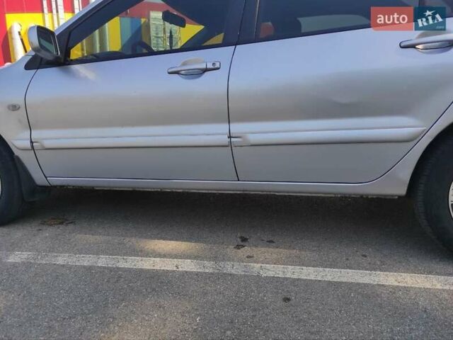 Серый Мицубиси Лансер, объемом двигателя 1.6 л и пробегом 187 тыс. км за 4500 $, фото 6 на Automoto.ua