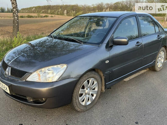 Сірий Міцубісі Lancer, об'ємом двигуна 1.6 л та пробігом 207 тис. км за 4800 $, фото 1 на Automoto.ua