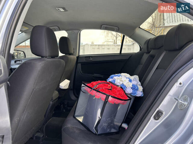 Сірий Міцубісі Lancer, об'ємом двигуна 1.5 л та пробігом 261 тис. км за 6200 $, фото 9 на Automoto.ua