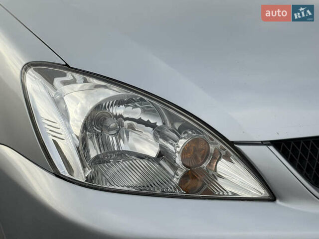 Серый Мицубиси Лансер, объемом двигателя 1.3 л и пробегом 160 тыс. км за 5555 $, фото 8 на Automoto.ua