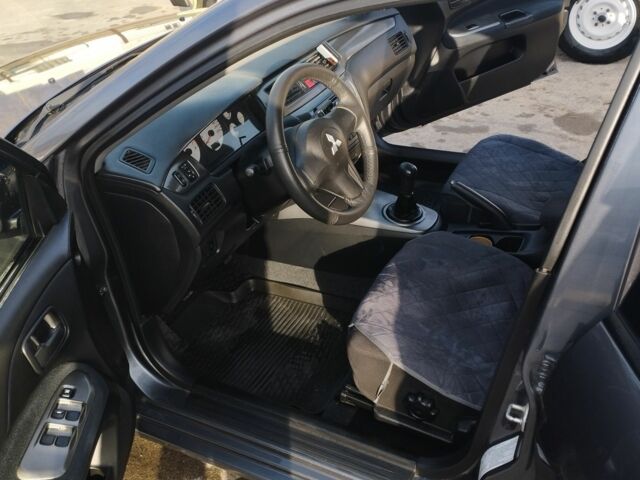 Сірий Міцубісі Lancer, об'ємом двигуна 1.6 л та пробігом 178 тис. км за 5464 $, фото 8 на Automoto.ua