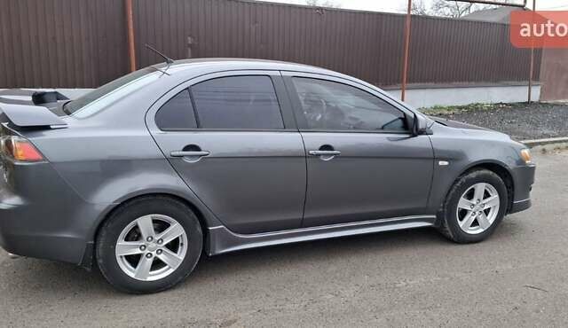 Серый Мицубиси Лансер, объемом двигателя 2 л и пробегом 189 тыс. км за 6800 $, фото 13 на Automoto.ua