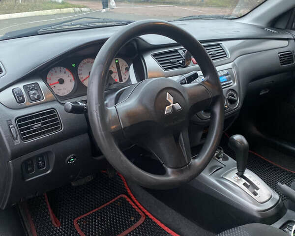 Серый Мицубиси Лансер, объемом двигателя 1.6 л и пробегом 346 тыс. км за 4299 $, фото 8 на Automoto.ua